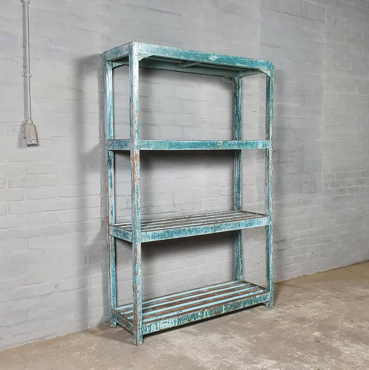 Vintage storage rack of old wood with blue patina