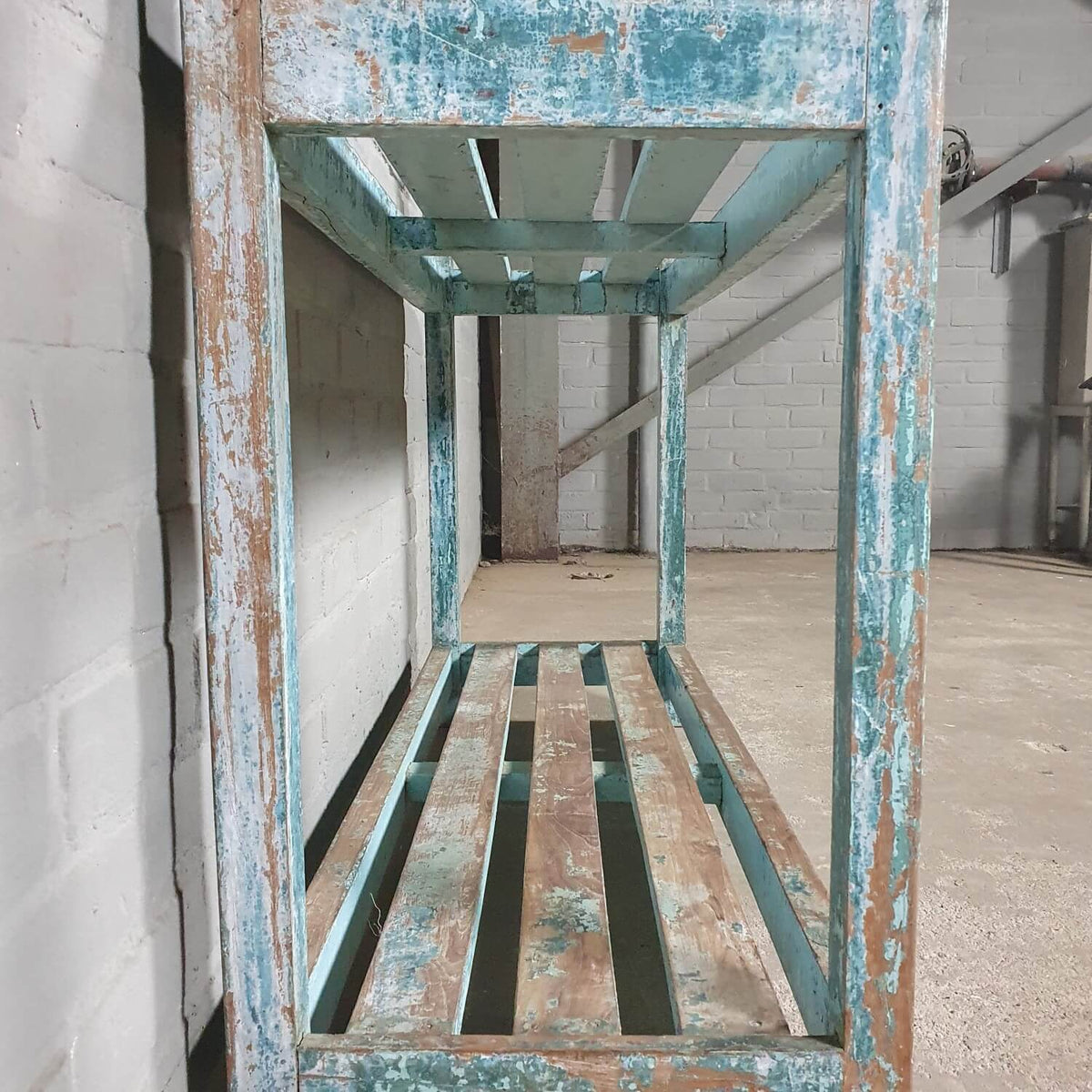 Vintage storage rack of old wood with blue patina