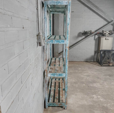 Vintage storage rack of old wood with blue patina