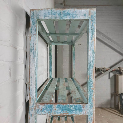 Vintage storage rack of old wood with blue patina