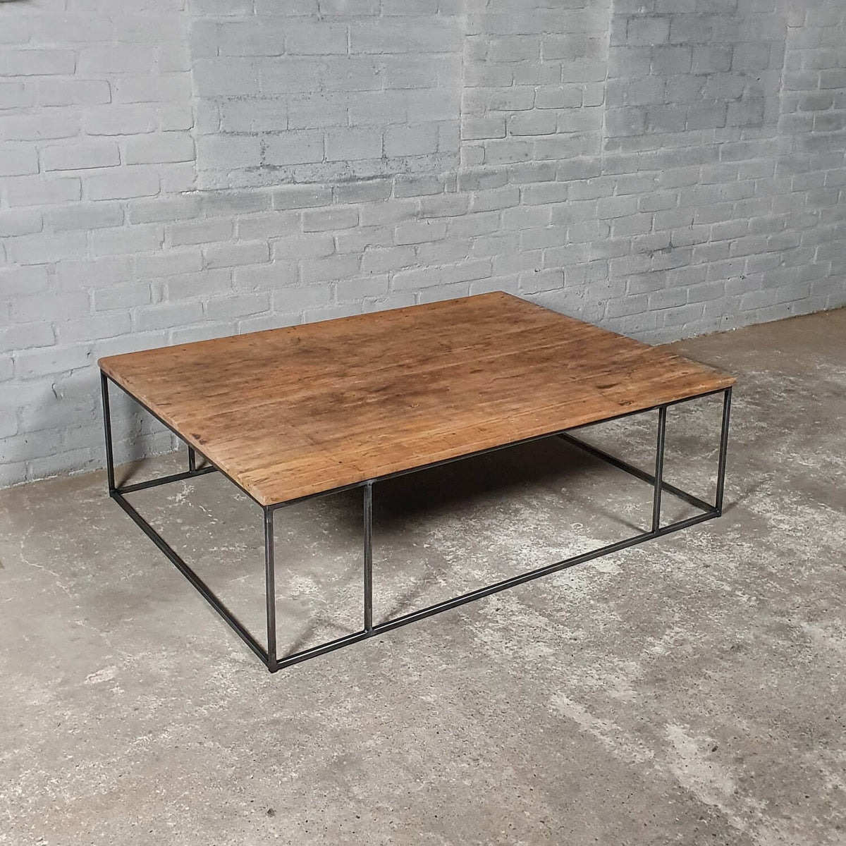 Industrial design coffee table – wood and thin steel base – IND770
