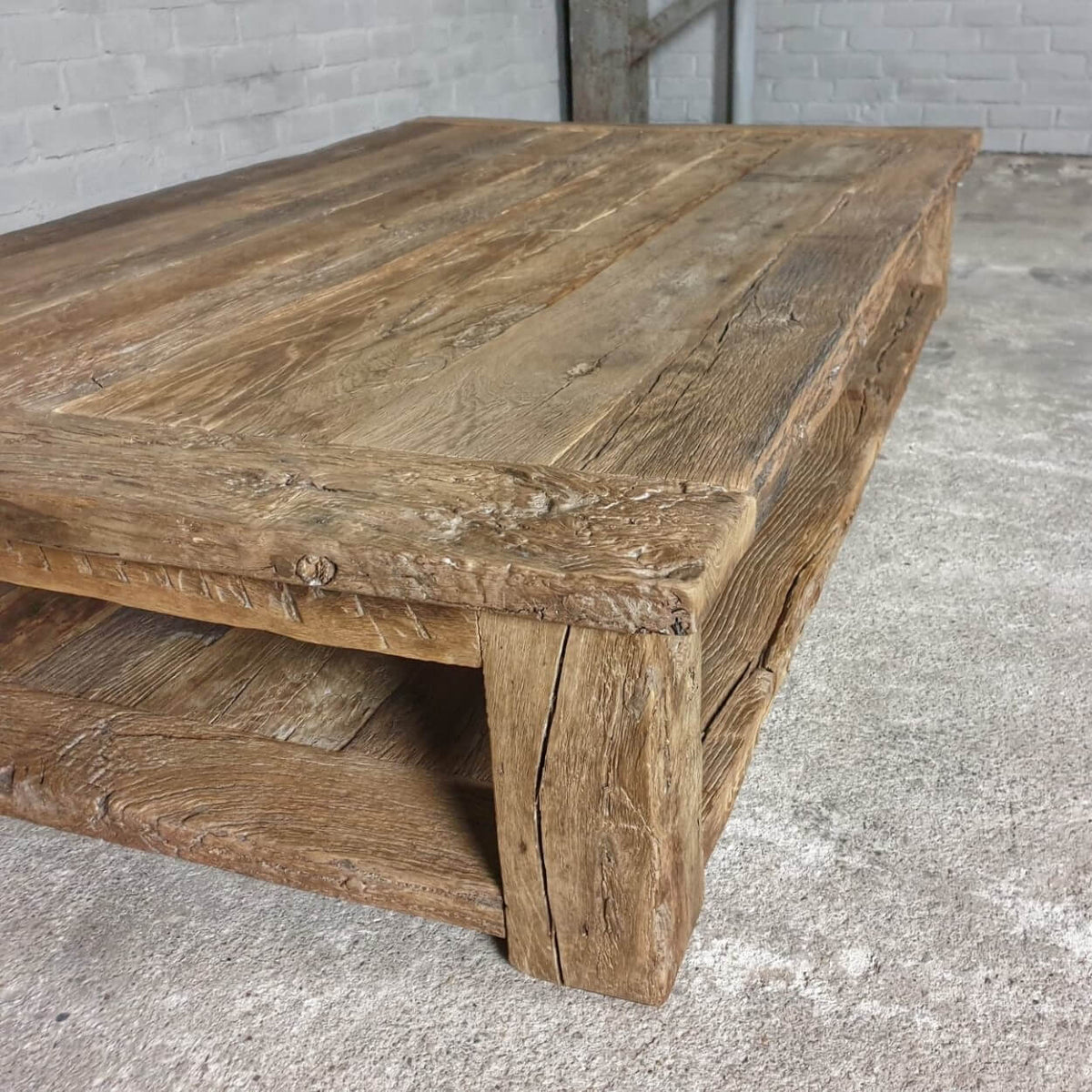 Robust farmhouse style coffee table Colmar – extra bottom shelf – sunburned reclaimed oak